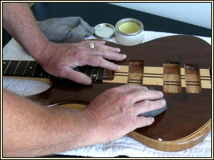 hand finishing a bass