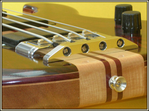 Hand made string anchor on cocobolo bass