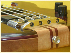 Hand made bridge on cocobolo bass